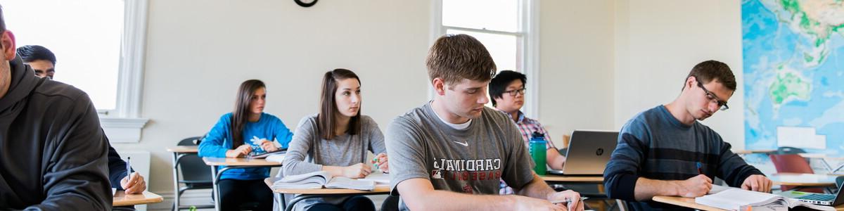 Classroom in Old Main with several students at their desks.